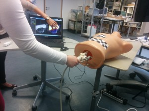 YEOUCH! the poor dummy is used as part of an AR rectal camera simulation for training!